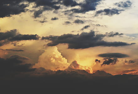 orange sun behind clouds thumbnail