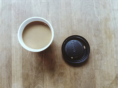 flay lay photography of cup filled with coffee thumbnail