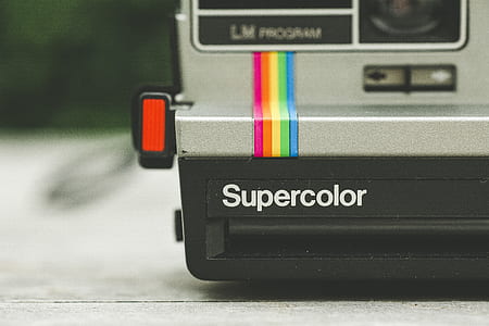 selective focus photo of black and gray Supercolor land camera thumbnail