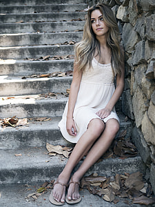 woman wearing white scoop-neck and sleeveless mini dress on stairways thumbnail