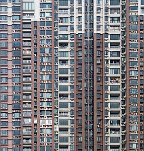 photo of white and brown concrete high-rise builing during daytime thumbnail