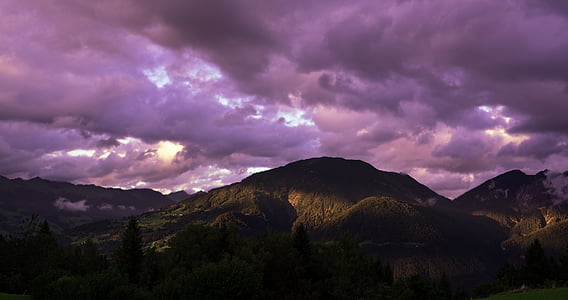 black mountains under purple clouds thumbnail