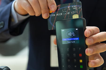 person holding credit card thumbnail