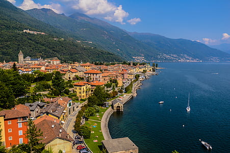 aerial photography of houses beside body of water thumbnail