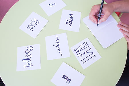 photo of person writing ideas text in white printing papers thumbnail