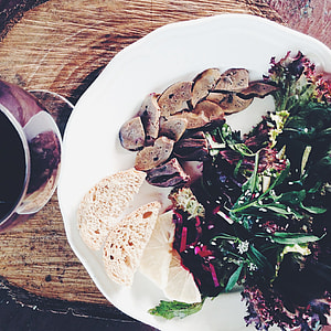 bread and vegetable salad on top of ceramic plate thumbnail