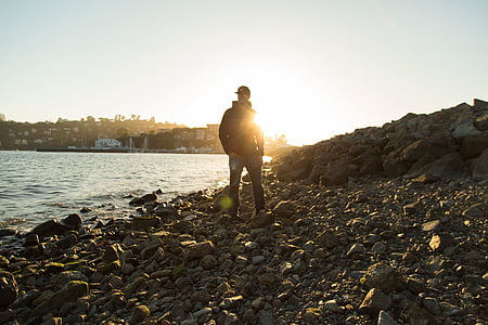 man standing up on rock surface thumbnail