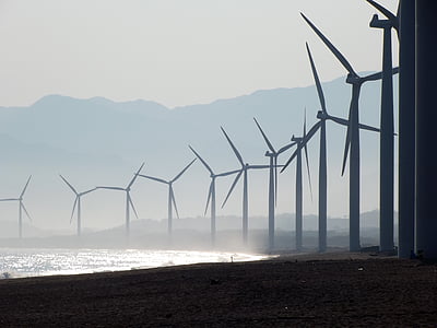 line of windmills in front of sea at daytime thumbnail