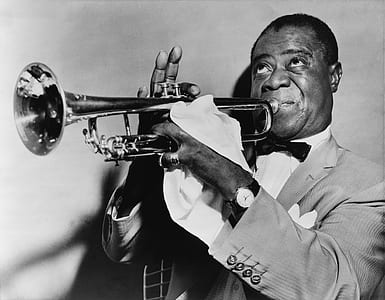 man playing a trumpet grayscale photo thumbnail