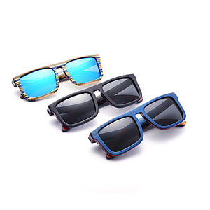 three yellow, black, and blue framed sunglasses thumbnail