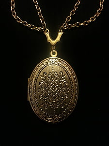 oval gold-colored locket thumbnail
