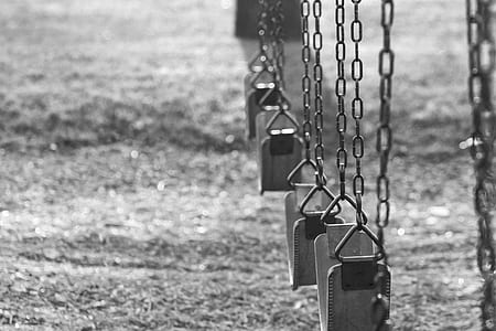 grayscale photography of swings thumbnail