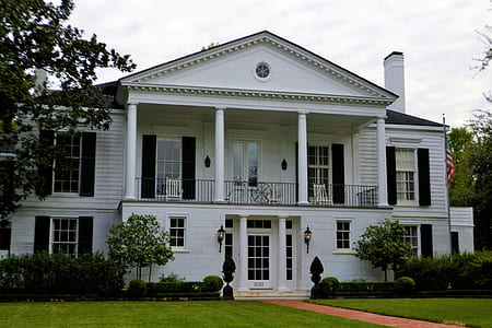 white house beside trees thumbnail