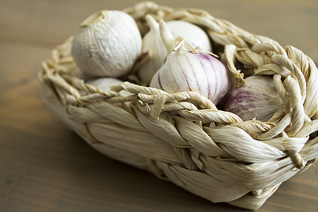 white garlics in white basket thumbnail