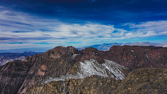 photo of brown and red mountains during daytime thumbnail
