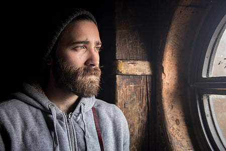 man standing behind the window thumbnail
