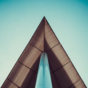 brown building under clear blue sky thumbnail