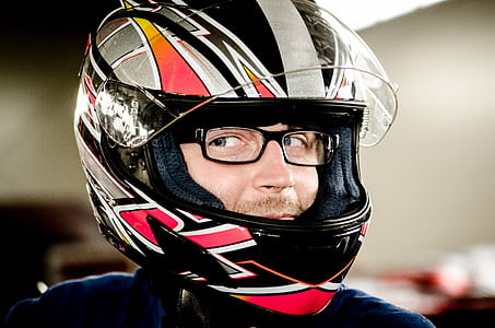 man wearing black, red, and white helmet thumbnail
