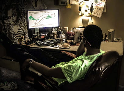 Person Sits in Front of Computer thumbnail