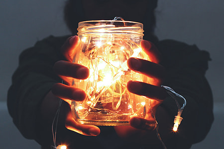 Man holding lights in a jar thumbnail
