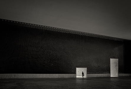 person inside building in grayscale photography thumbnail