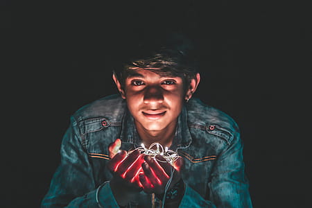 Man Holding White String Light Photo thumbnail