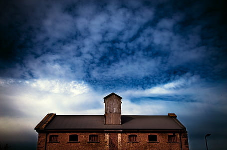 landscape photography of brown stone house during night thumbnail