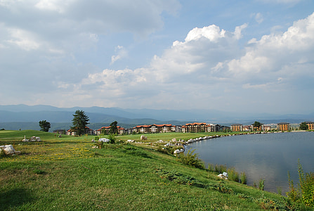 body of water under cloudy sky thumbnail