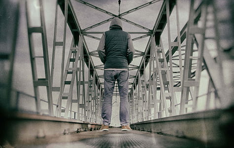 man standing on bridge thumbnail