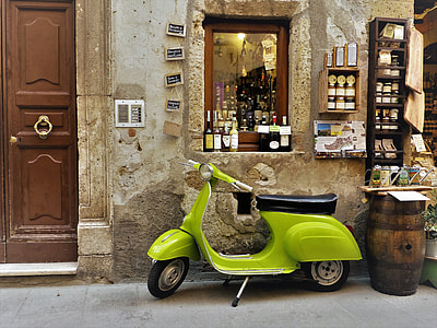 green automatic scooter beside bottles thumbnail
