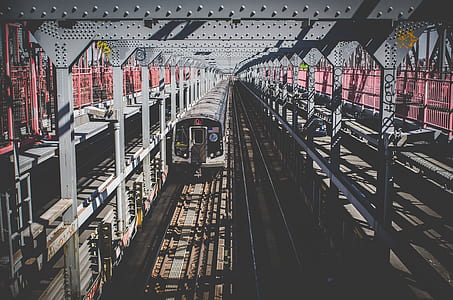 train on rail during daytime thumbnail