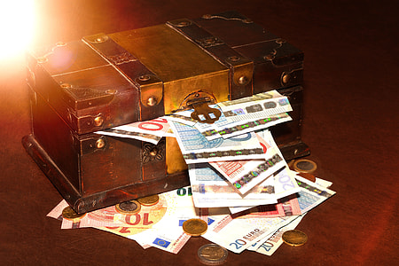 brown trunk with banknotes and coins thumbnail