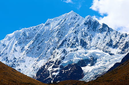 mountain covered by snow during daytime thumbnail