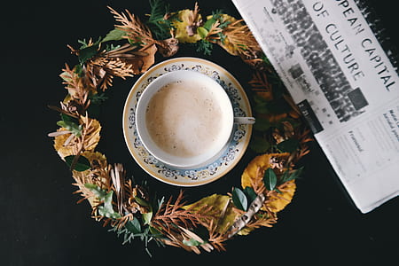 flat lay photography of teacup filled with coffee thumbnail
