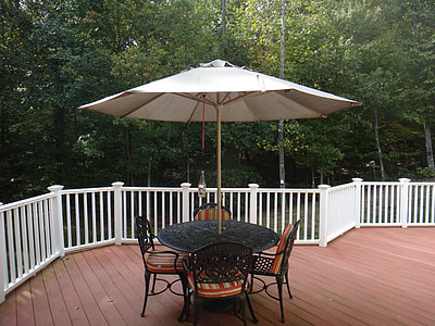 round black and brown patio dinning set near tree thumbnail