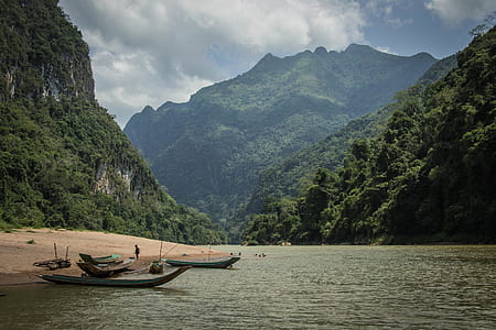 brown boat near shore thumbnail