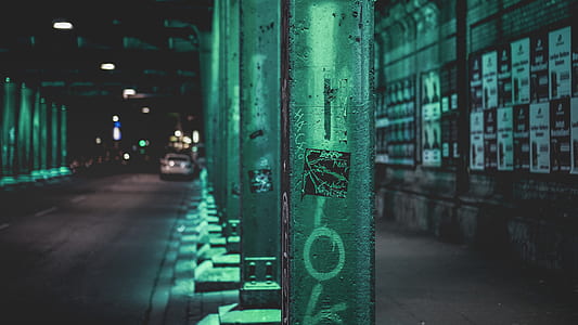 close up photography of metal pillar at night time thumbnail
