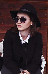 woman sitting on chair looking at her right thumbnail