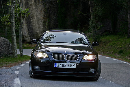 black BMW E92 coupe on gray asphalted road thumbnail