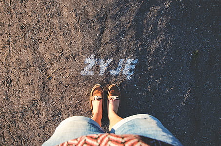 person standing on ZYJE letters marked in surface thumbnail
