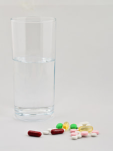 clear highball glasses and assorted medicines thumbnail