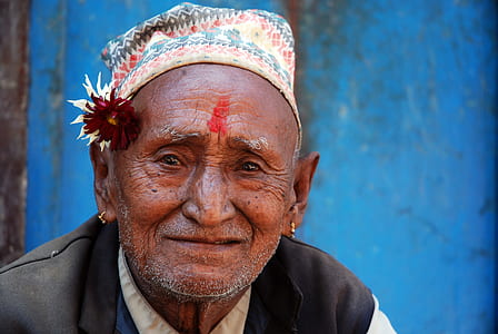 man sitting near blue wall paint thumbnail