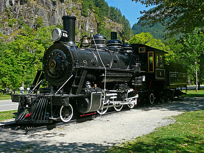 black and gray train on black rail during daytime thumbnail