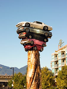 pile of five cars on tree stump thumbnail