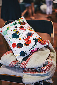 Close-ups of pillows and a grey sofa thumbnail