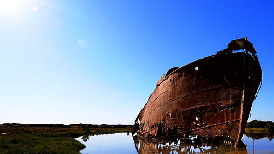 brown ship during daytime thumbnail