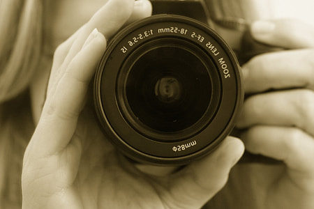 person holding DSLR camera thumbnail