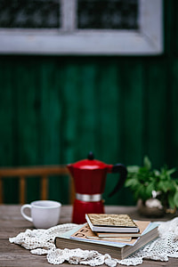 Stack of organizers and red italian coffee maker thumbnail