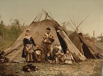 group of people and children standing near teetee tent thumbnail