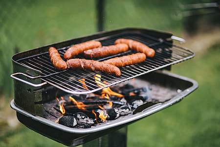 Pork and sausage on the grill thumbnail